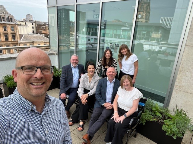 Staff from Breathing Space and PwC at the launch of the new bench in Glasgow